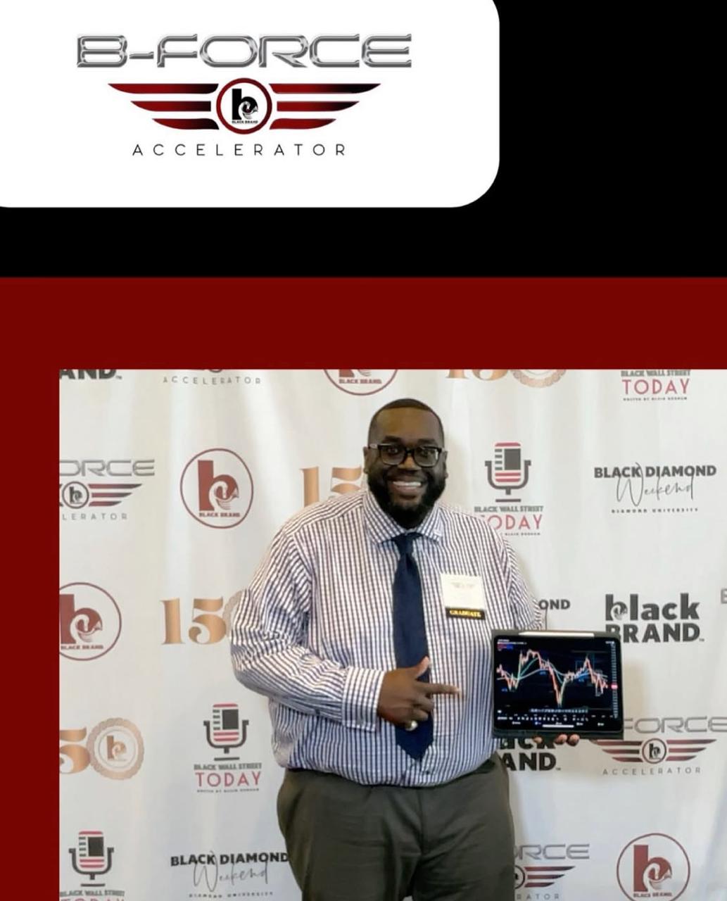 Brian Lewis at a professional event with a trading chart